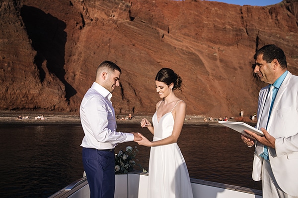 breathtaking-styled-shoot-board-magnificent-view-caldera-santorini-endless-blue-sea_15