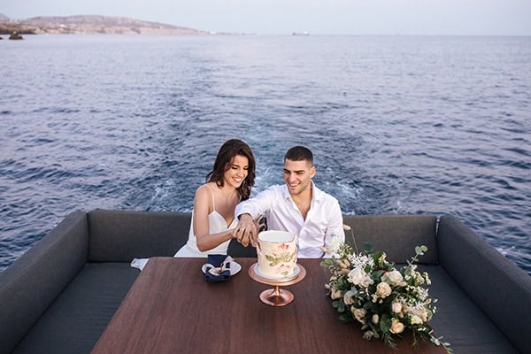 breathtaking-styled-shoot-board-magnificent-view-caldera-santorini-endless-blue-sea_19