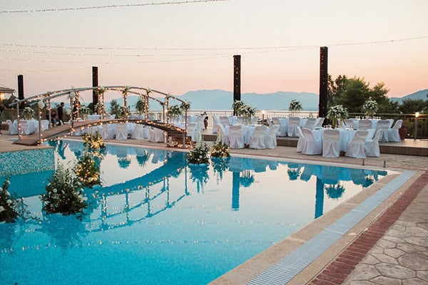 elegant-summer-wedding-palairos-white-roses-lycianthus-olive-leaves_17z