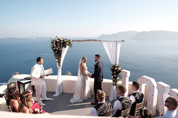 intimate-wedding-santorini-island-burgundy-hues-bright-letters_16