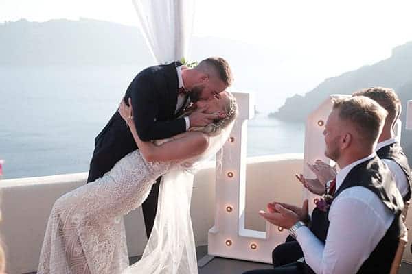 intimate-wedding-santorini-island-burgundy-hues-bright-letters_18