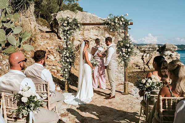 outdoor-summer-wedding-corfu-white-blooms-lush-olive-leaves_24