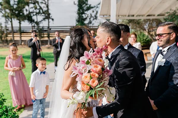 summer-wedding-nicosia-beautiful-florals-orchids-roses-white-coral-hues_30