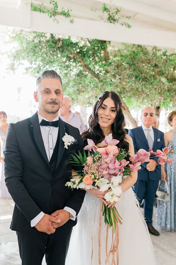 summer-wedding-nicosia-beautiful-florals-orchids-roses-white-coral-hues_31