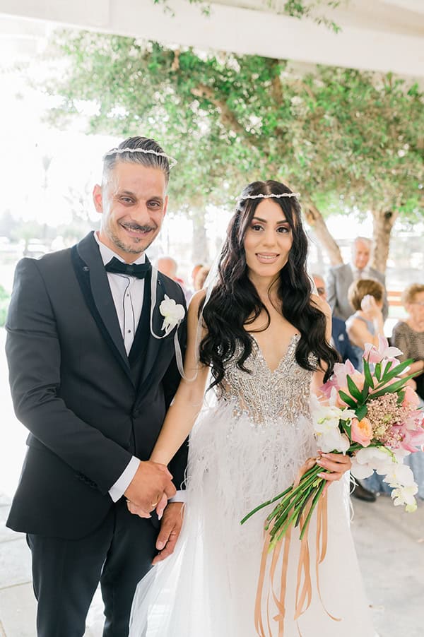 summer-wedding-nicosia-beautiful-florals-orchids-roses-white-coral-hues_35