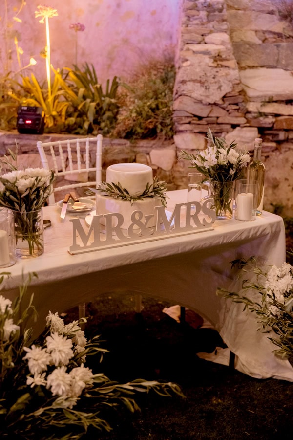 Summer Wedding In Naxos With White Flowers And Olive Leaves