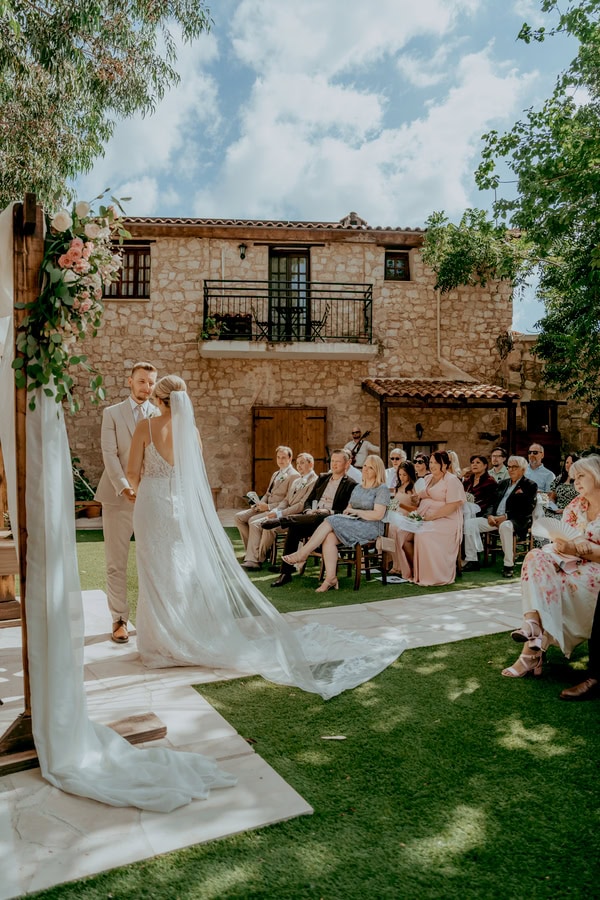 Destination Wedding At Vasilias Nikoklis Inn With Roses And Lisianthus